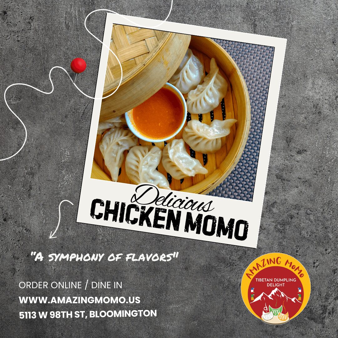 Steaming basket of chicken dumplings with dipping sauce, on a textured surface.