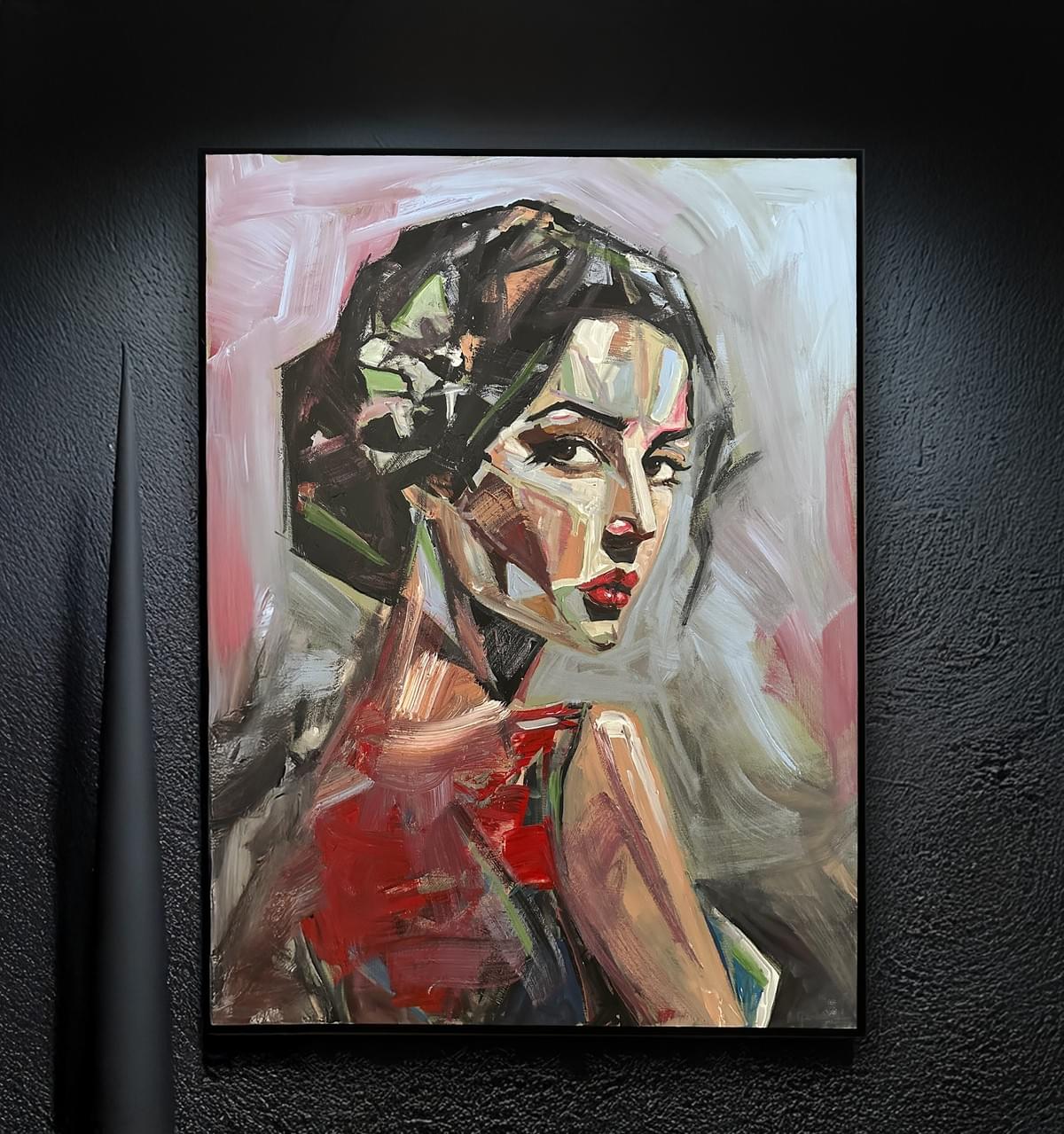 Portrait of a woman with dark hair, red lips, and a red top, painted in an abstract style with bold brushstrokes.