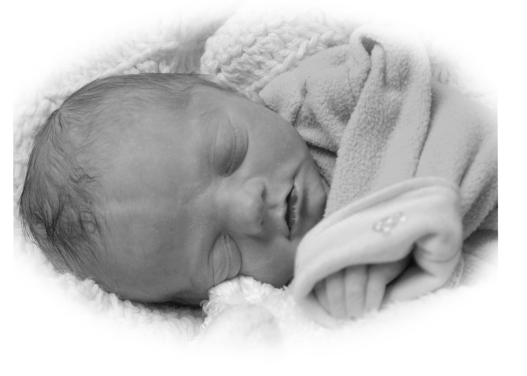 Sleeping newborn baby wrapped in a blanket, resting peacefully on a soft surface.