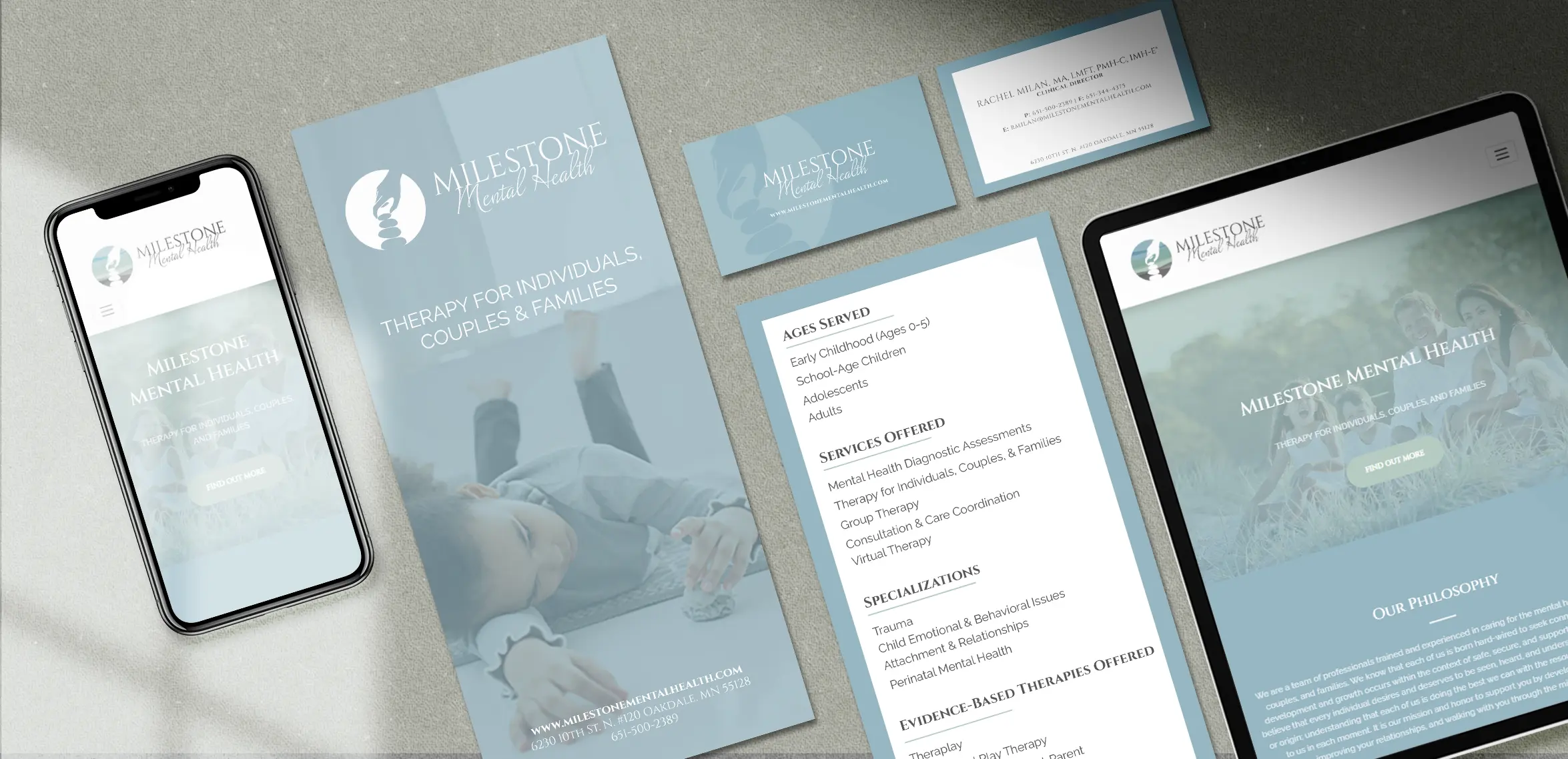 Medical brochures, business cards, and digital devices on a table, displaying healthcare information.