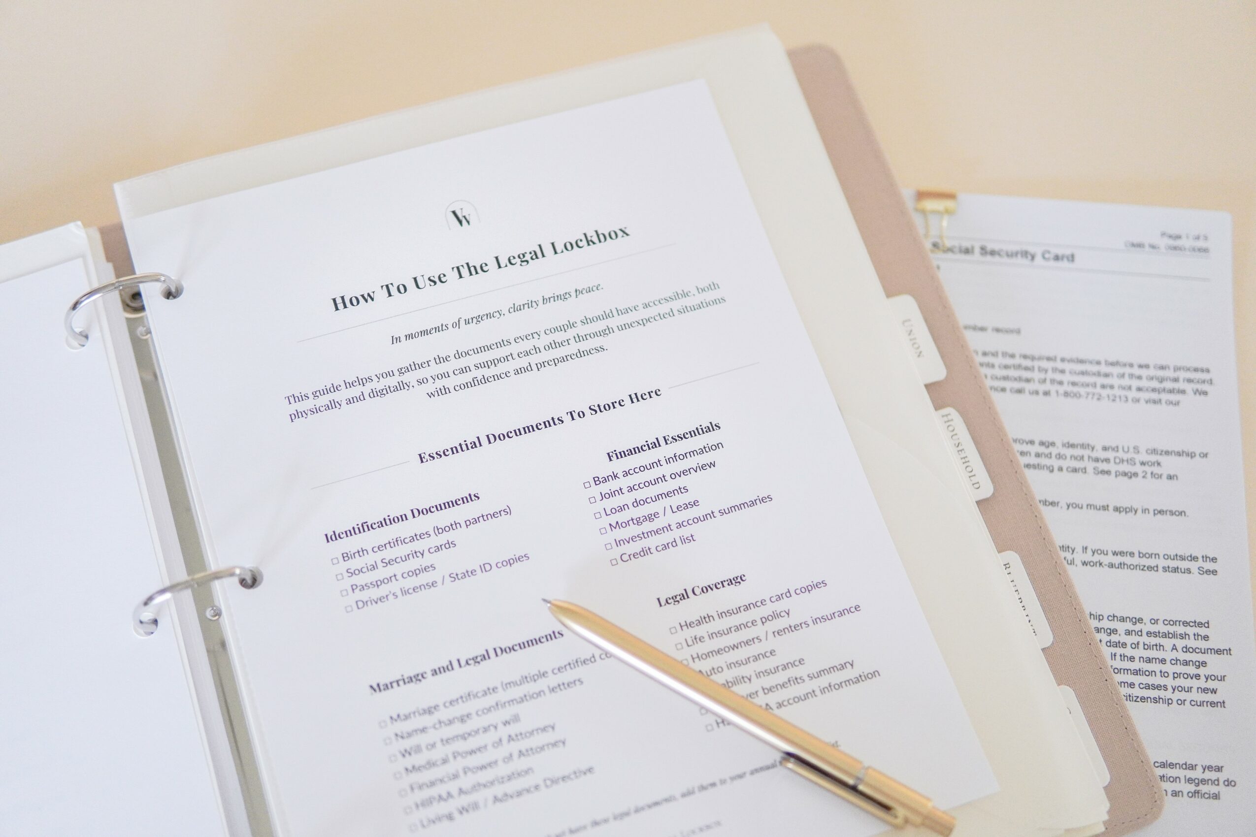 Open binder with printed document titled 'How To Use The Last Lockdown' and a pen resting on it, with a paper behind.