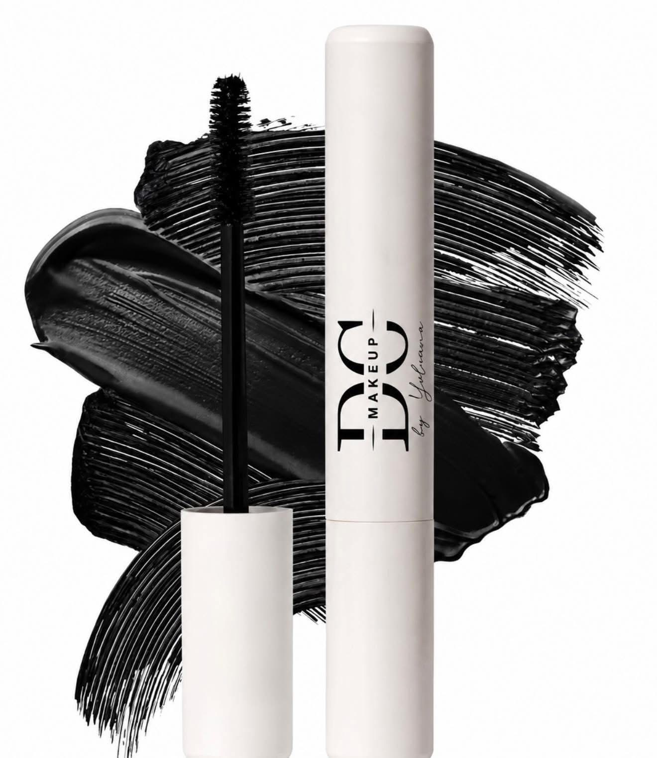 Mascara tube with wand, black mascara smear background, white tube, and wand with brush, minimalistic design, product display.