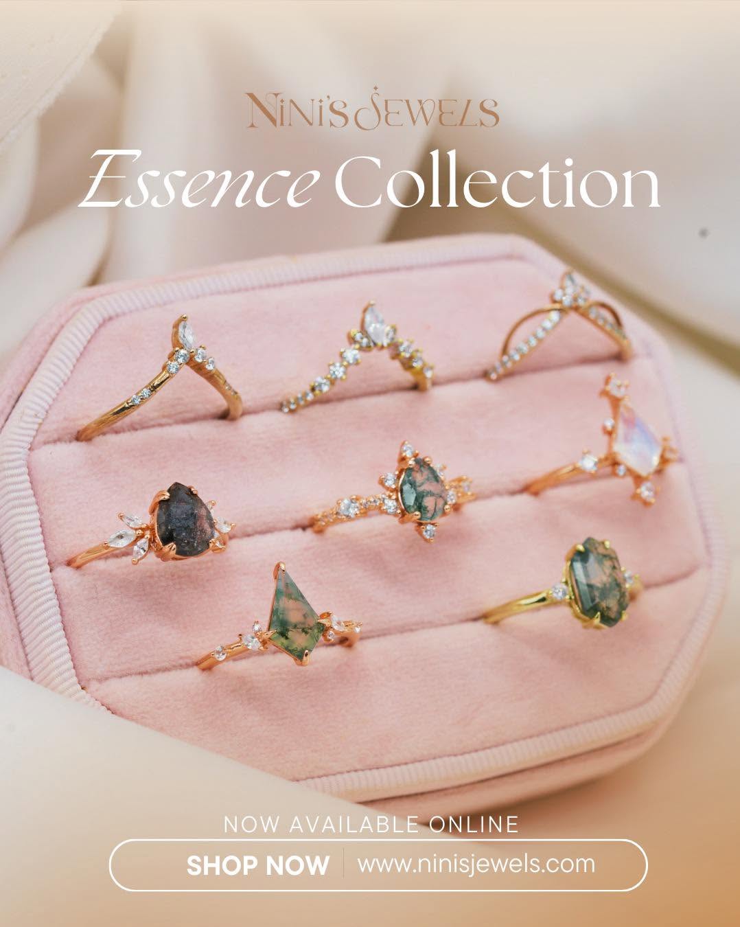 Six rings with gemstones displayed in a pink jewelry box, promotional text for Ninis Jewels Essence Collection, shop online link.