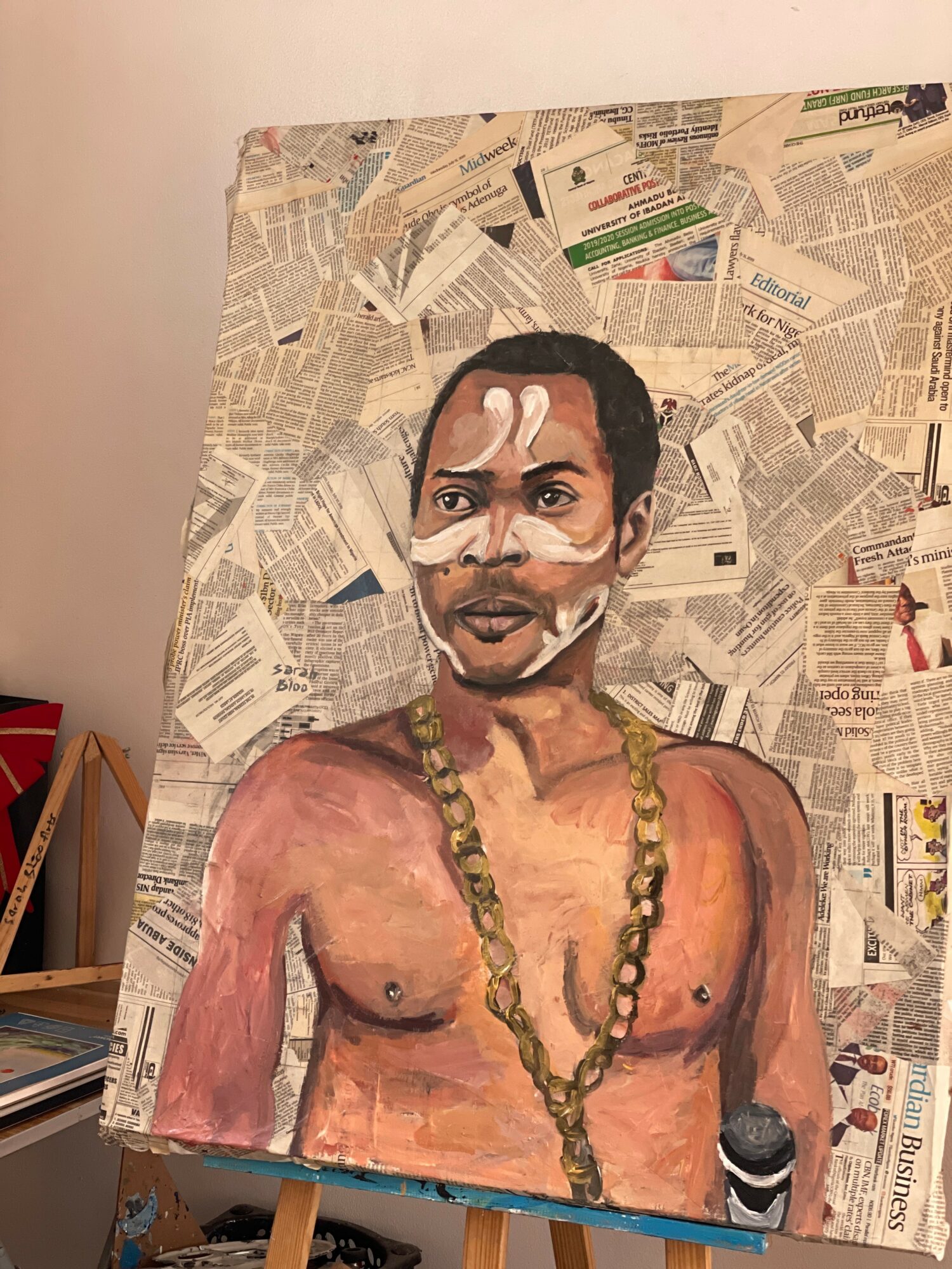 Painting of a shirtless man with a necklace, holding a microphone, against a background of newspaper clippings.