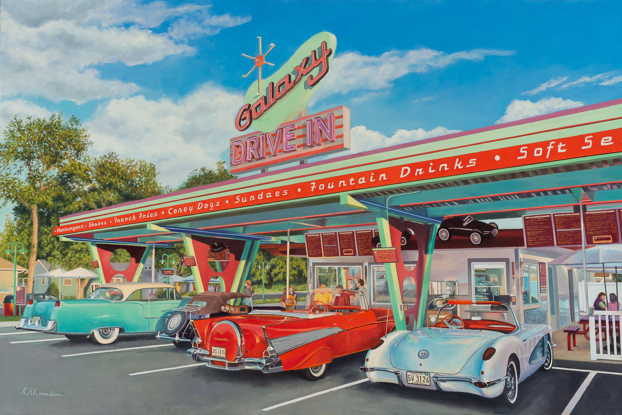Diner with vintage cars parked outside, colorful sign, and a bright blue sky with clouds.
