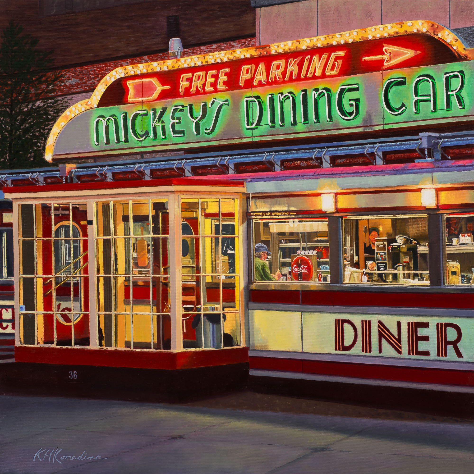 Neon-lit vintage diner with signs for free parking and Mickey's dining car, featuring large windows and a colorful exterior.
