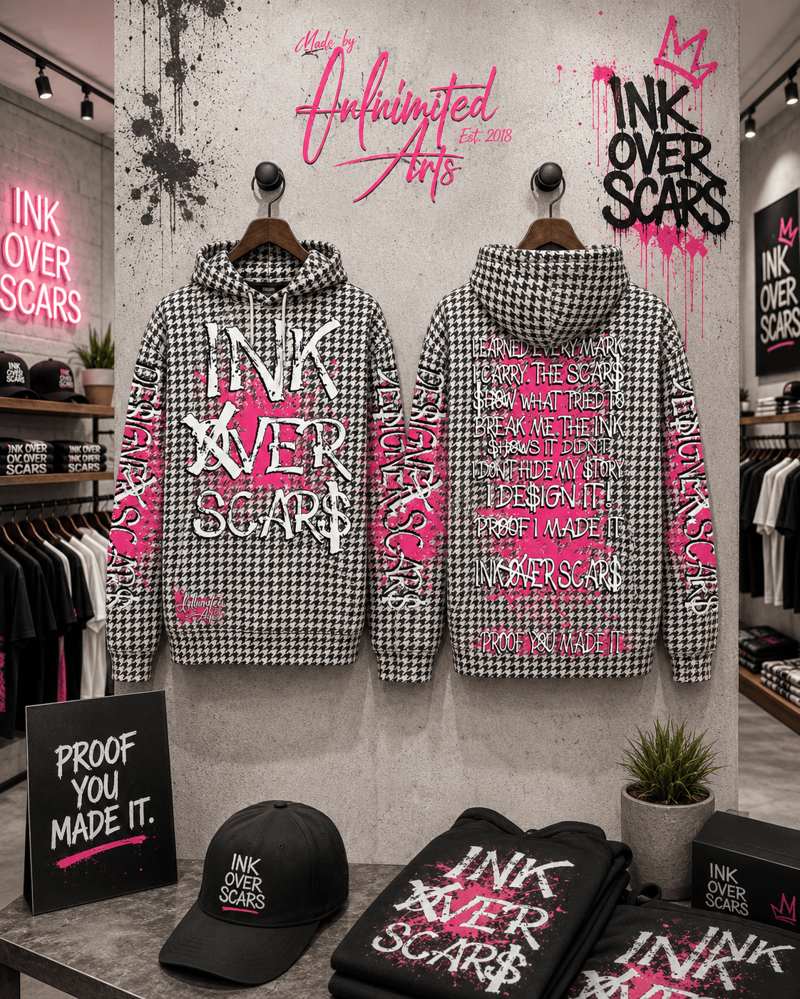 Two checkered hooded jackets with graffiti-style text and designs hang on a wall, with pink and black graffiti art above and around them. A black cap and two black bags with similar text are on a table below. The background shows a retail store interior.