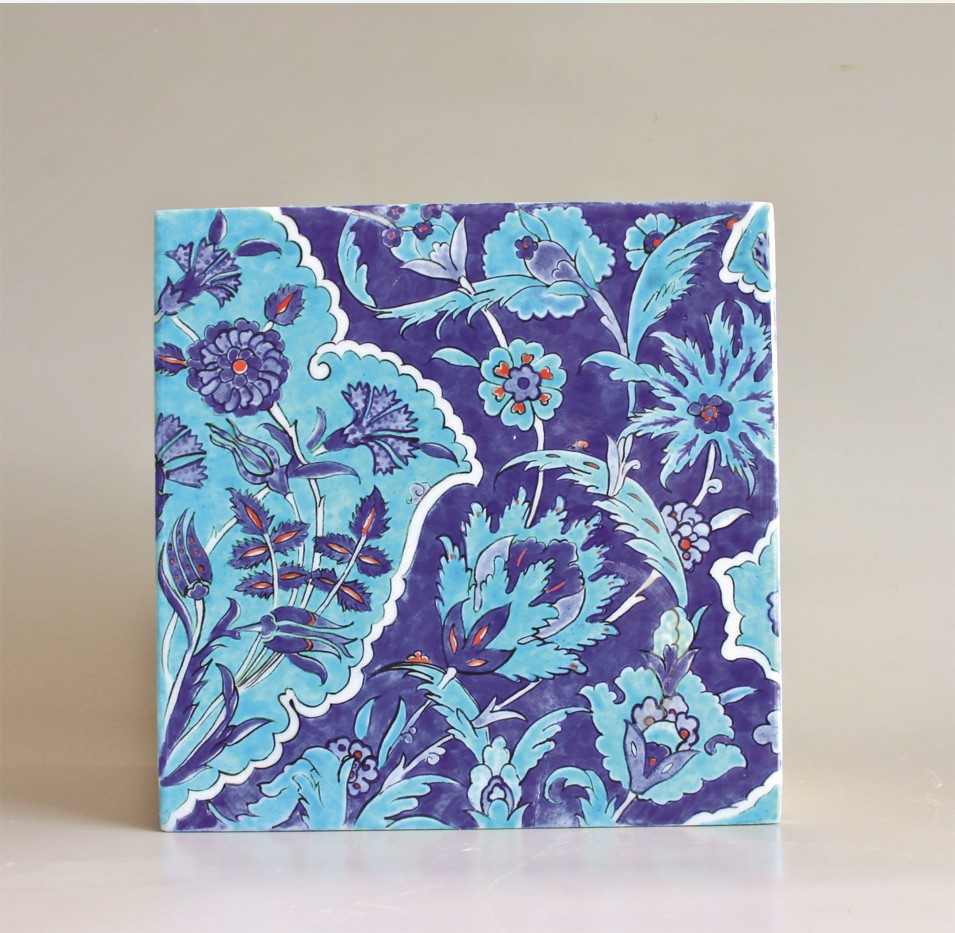 Square artwork with blue floral pattern on a light background, featuring various flowers and leaves in shades of blue.