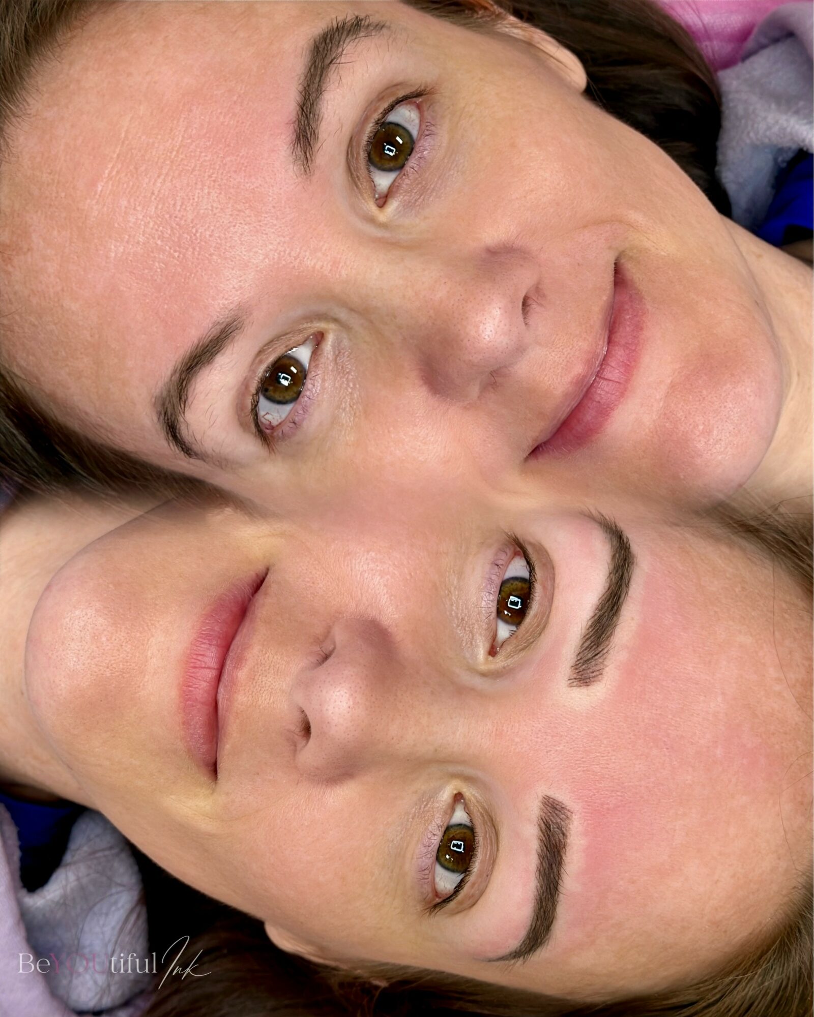 Two women with light skin and dark hair lying close together, smiling, with their faces touching.