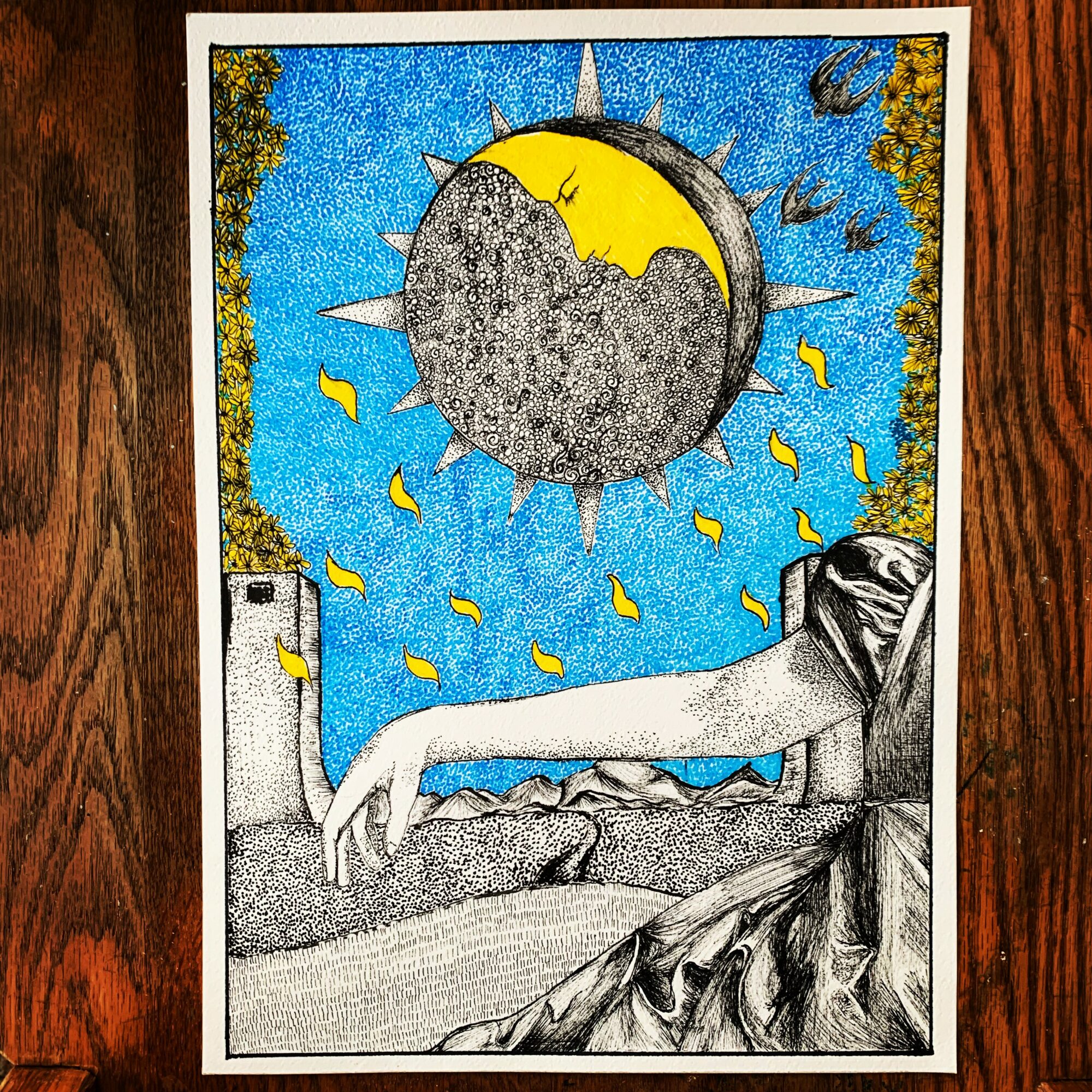 A surreal illustration with a large moon, sun, and stars in a blue sky, and a reclining figure in the foreground.