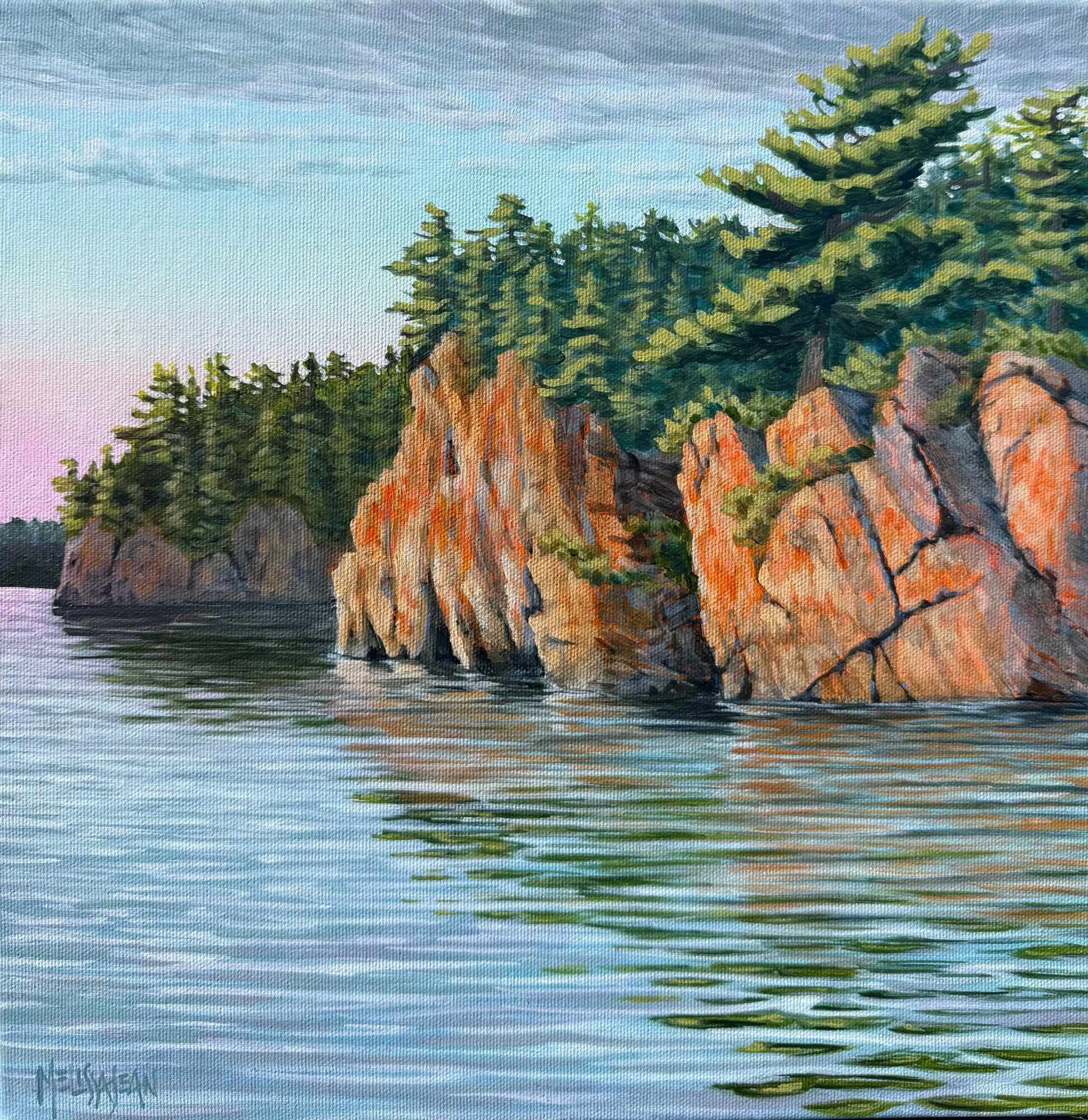 Cliffside with trees beside a calm body of water, reflecting the landscape, under a partly cloudy sky.